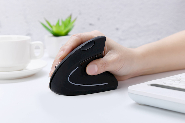 woman working with vertical mouse