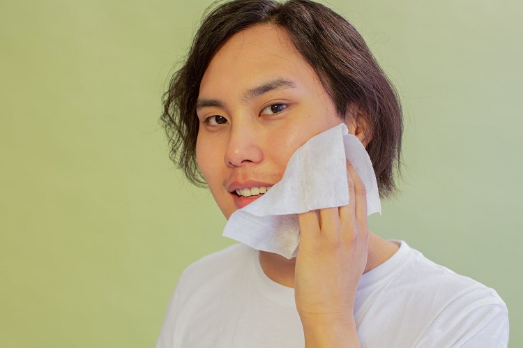 picture of man using skin care product