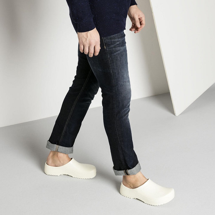 picture of a men legs in jeans and clogs