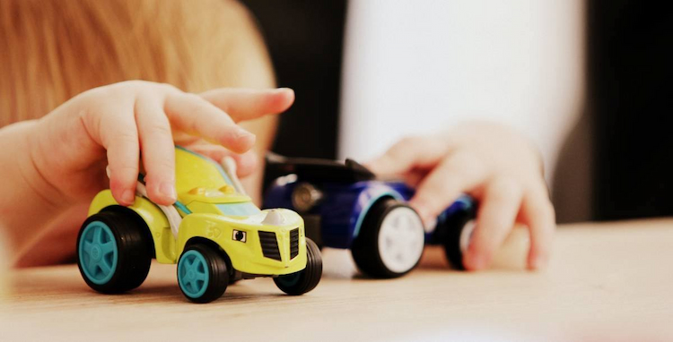 kids playing with car toys