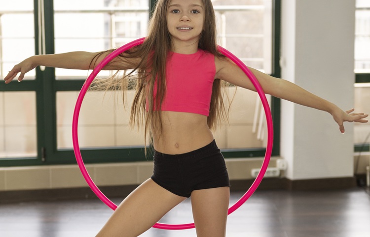 little girl in gymnastics clothing